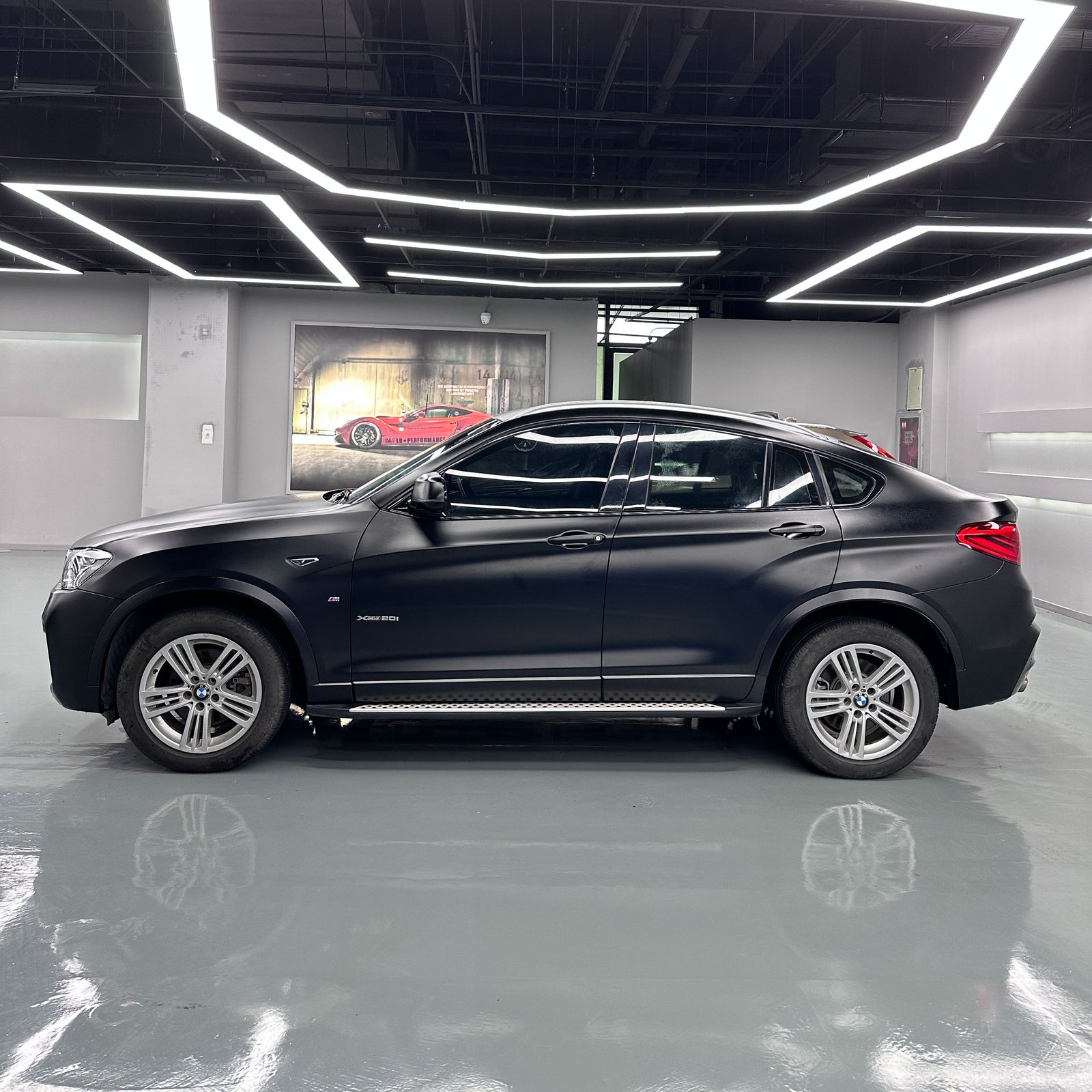 BMW X4 wrapped in Satin Black Vinyl Wrap.