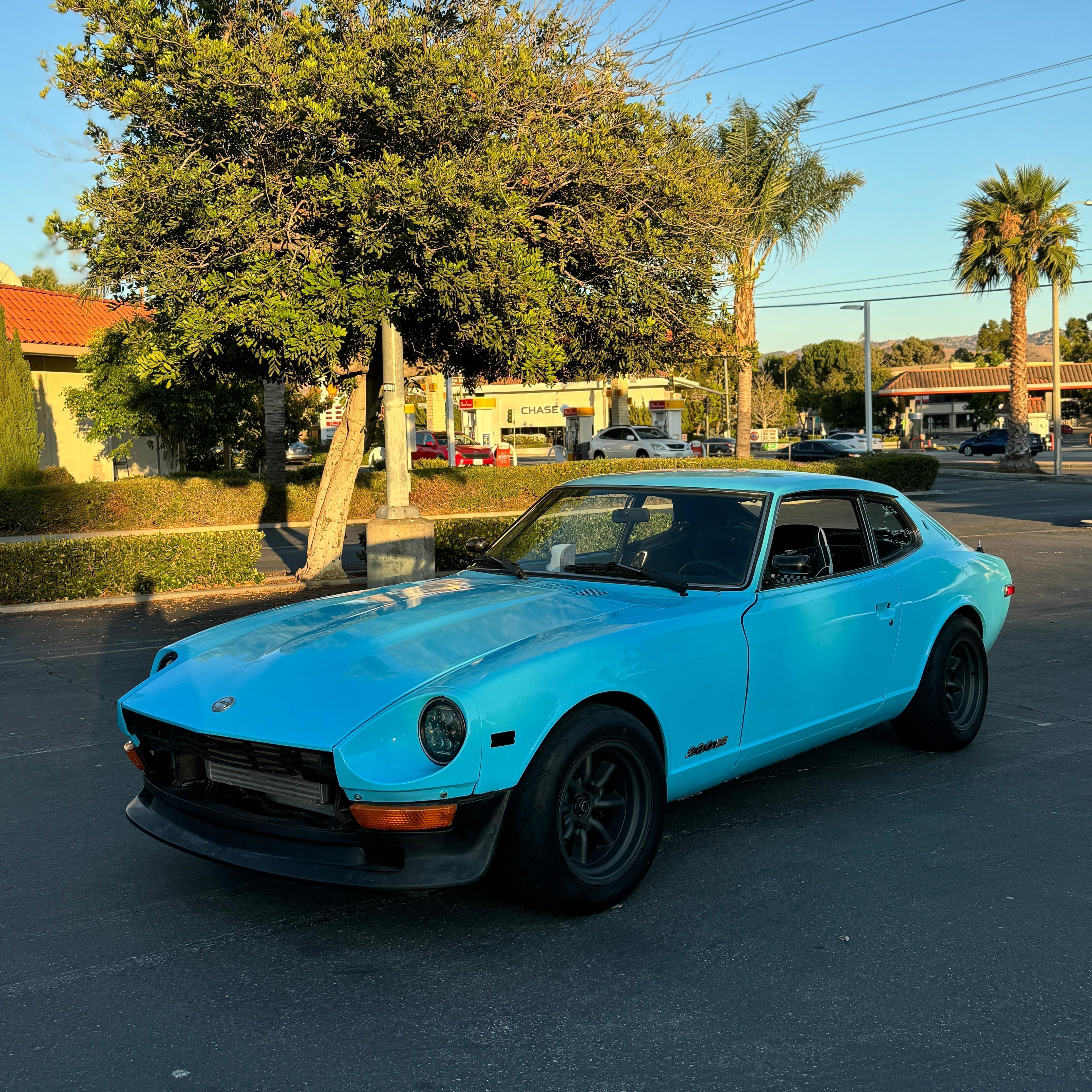 High Glossy Sky Blue vinyl wrapped classic Datsun sports car