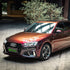 Audi wrapped in Rainbow Drift Black Red vinyl wrap side view.
