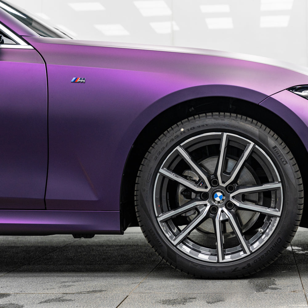 BMW 5 Series wrapped in Matte Russian Violet Vinyl Wrap.