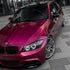 BMW wrapped in Glossy Metallic Rubellite Purple vinyl wrap side view