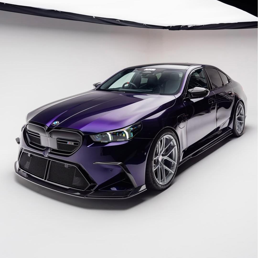 BMW M5 wrapped in Glossy Metallic Midnight Purple Color PPF vinyl wrap.
