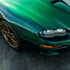Chevrolet Camaro wrapped in Glossy Metallic La Salle Green vinyl wrap side view.