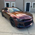 Chevrolet Camaro wrapped in Rainbow Drift Black Red vinyl wrap.
