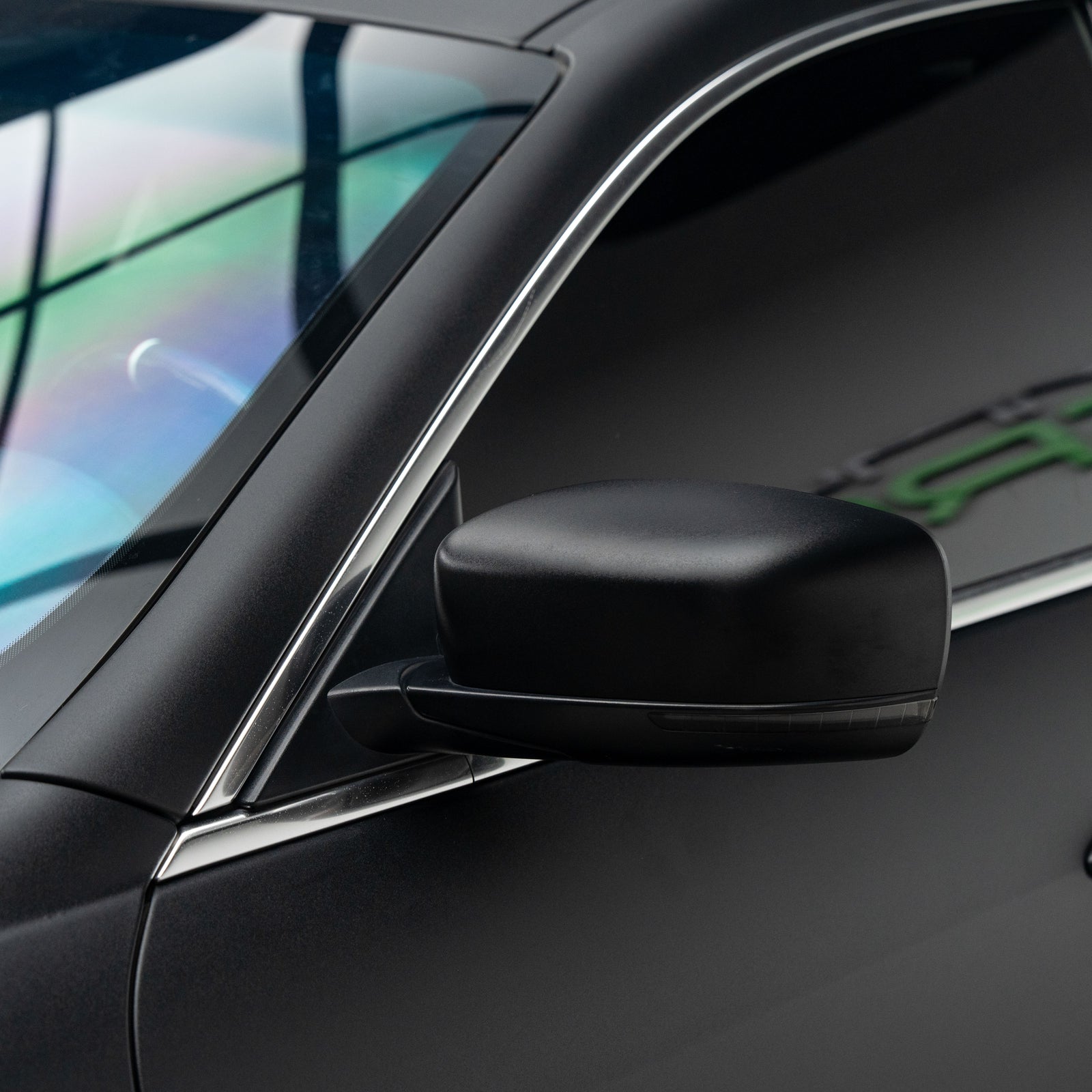 Maserati Quattroporte wrapped in Satin Black Vinyl Wrap side mirror.