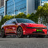 Electric sedan wrapped in Glossy Metallic Dragon Blood vinyl wrap.