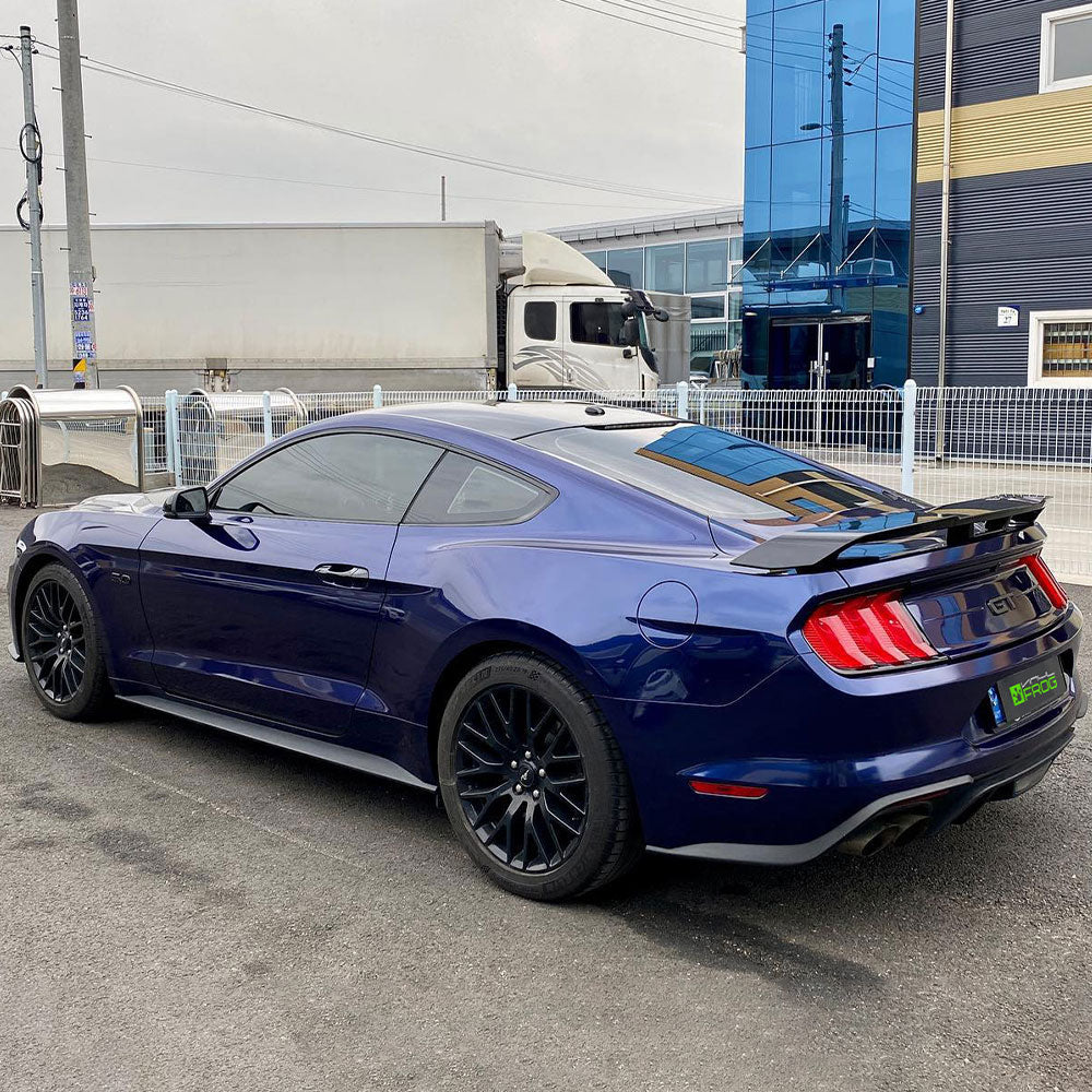 Ford Mustang wrapped in Glossy Metallic Tanzanite Blue vinyl wrap back view.