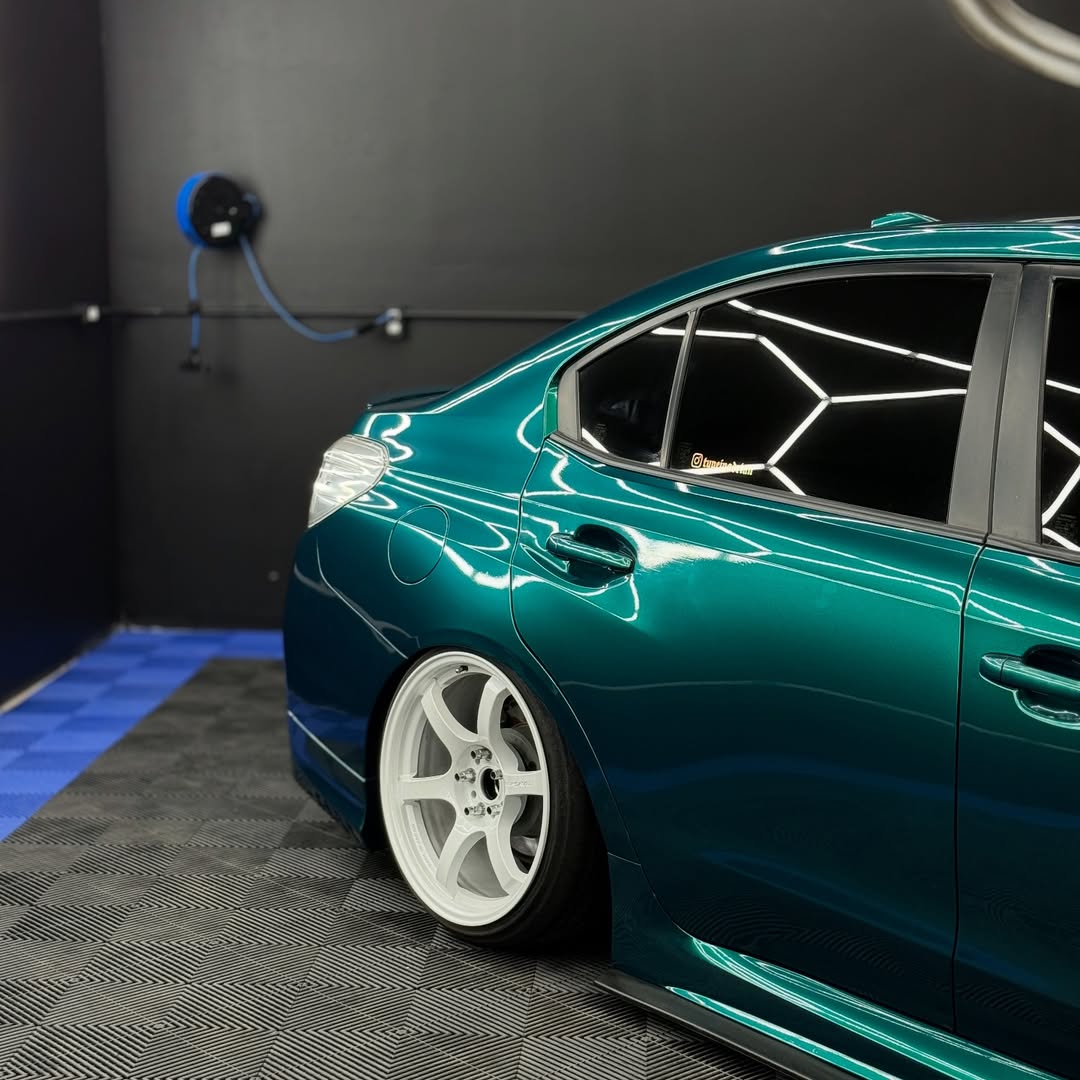 Deep Sea Green Subaru Rear Quarter