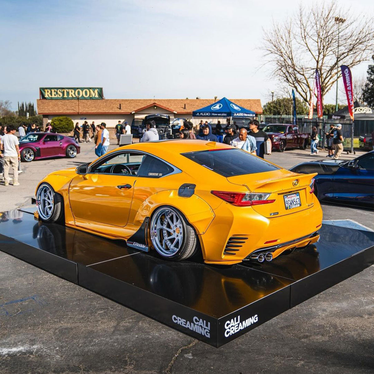 Lexus wrapped in Glossy Metallic Golden Yellow vinyl wrap back view.
