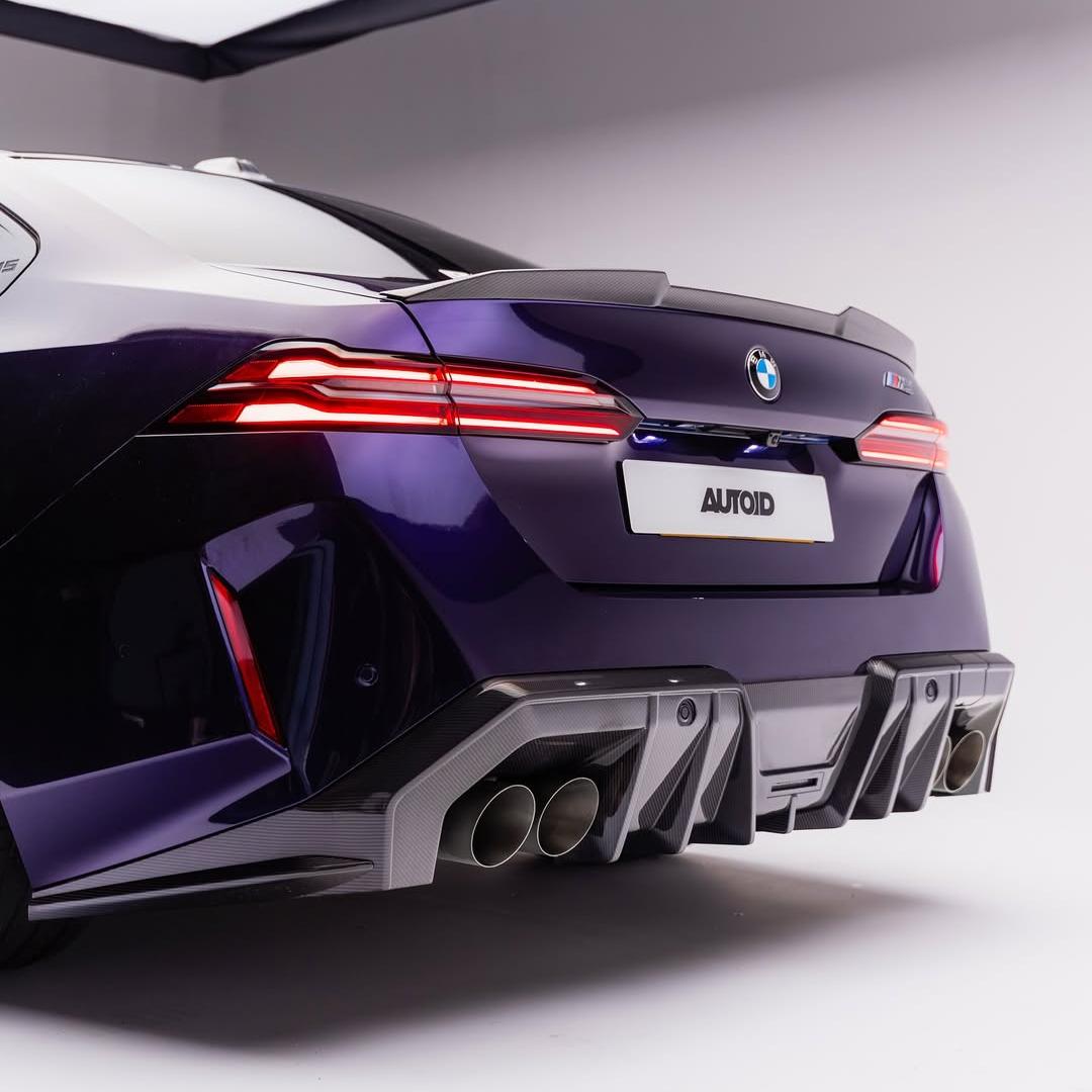 BMW M5 wrapped in Glossy Metallic Midnight Purple Color PPF side view.
