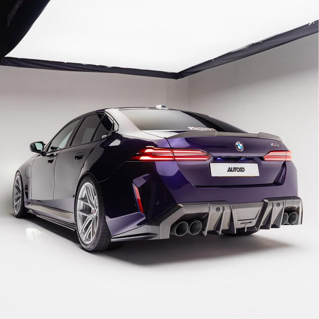 BMW M5 wrapped in Glossy Metallic Midnight Purple Color PPF back view.
