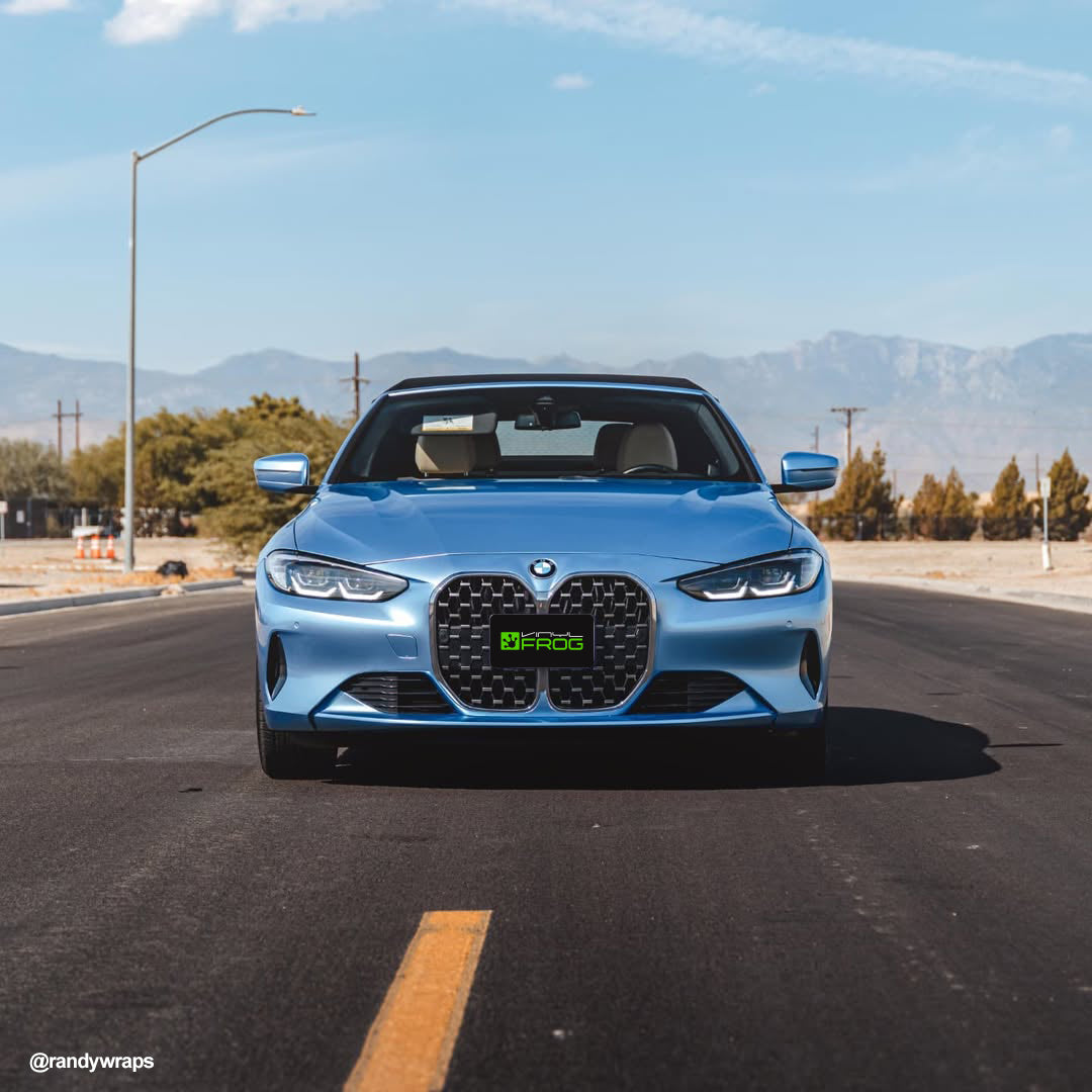 BMW 4 Series Convertible wrapped in Glossy Metallic Silver Lake Blue vinyl wrap on rod .