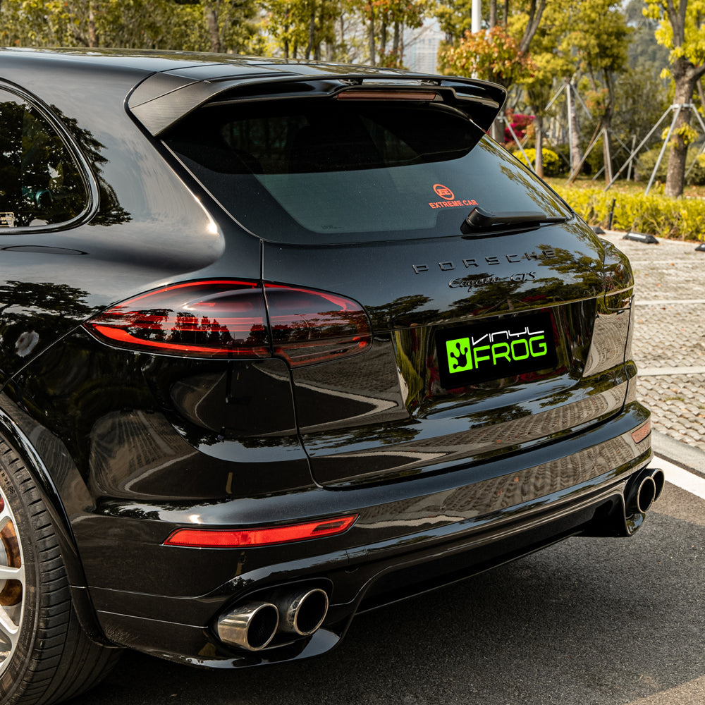 Porsche Cayenne wrapped in High Glossy Paint Black vinyl wrap back view.