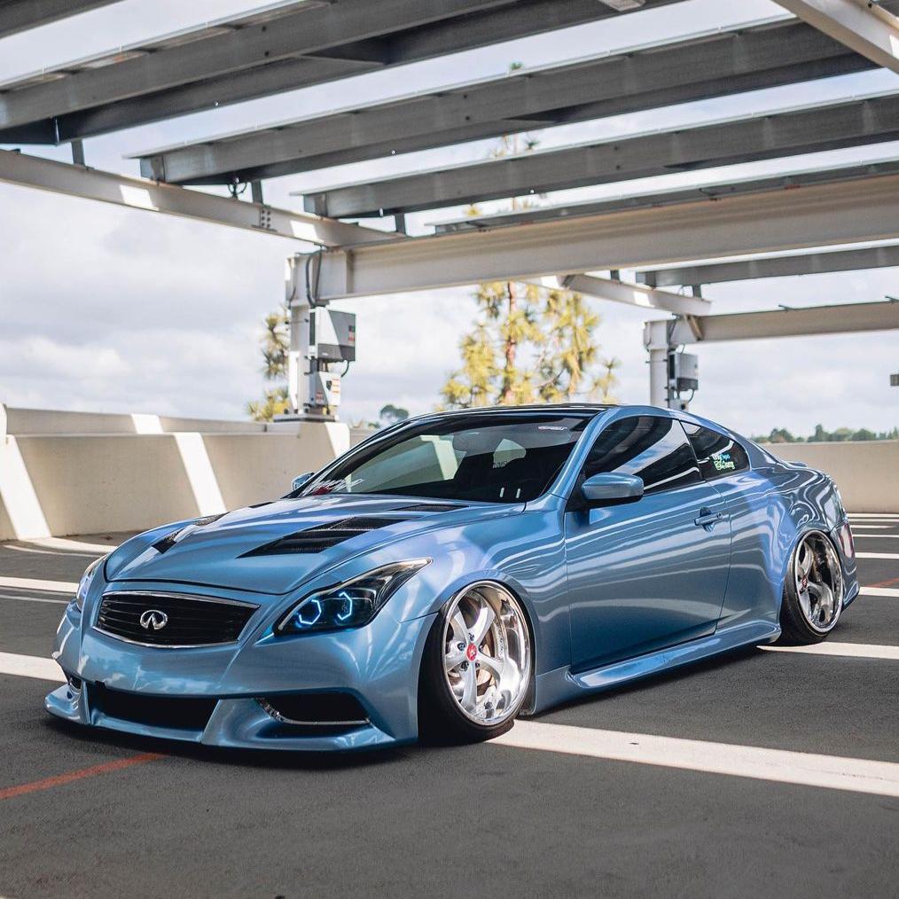 Infiniti G37 wrapped in Glossy Metallic Silver Lake Blue vinyl wrap.