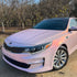 Kia Optima wrapped in Candy Metallic Pink White vinyl wrap.