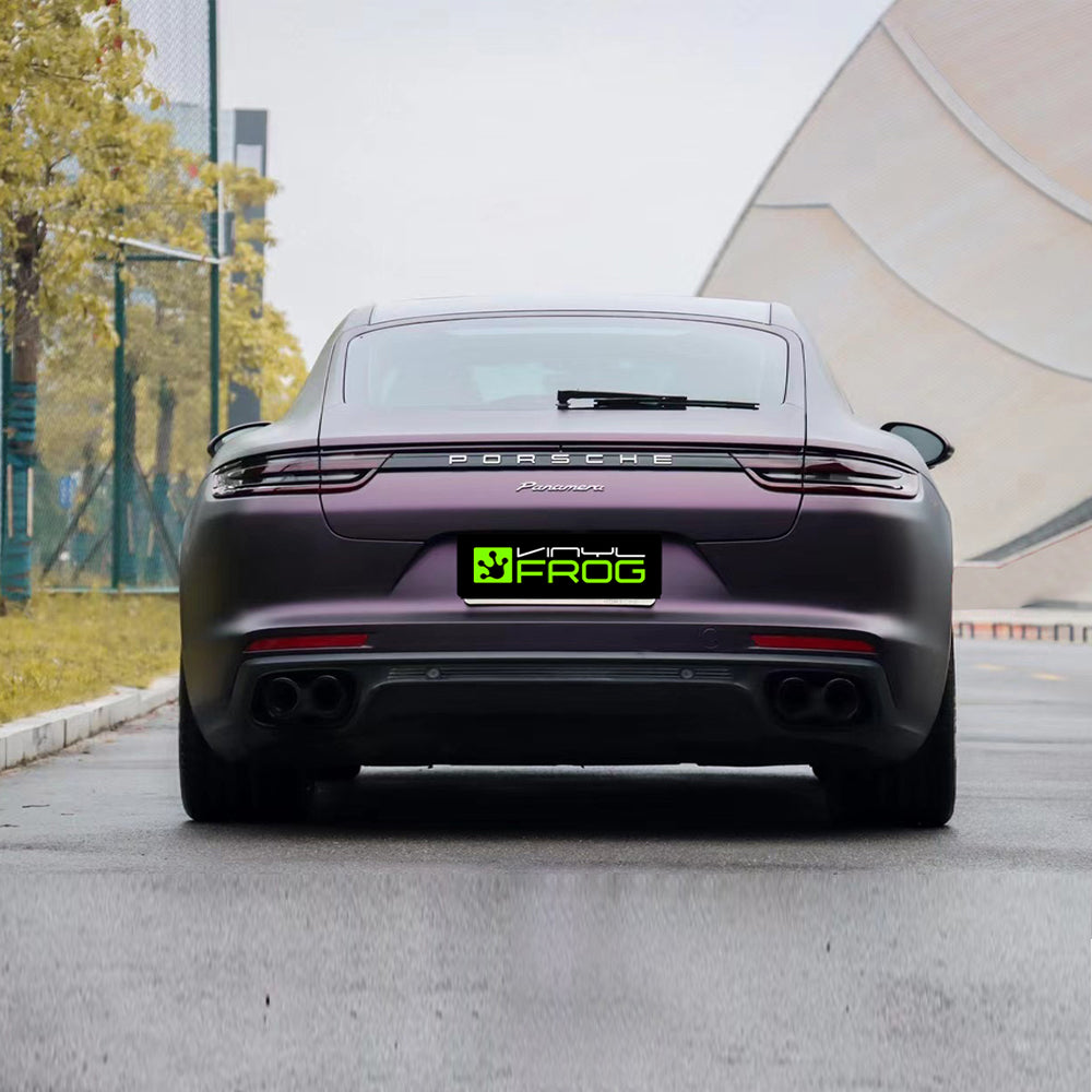 Porsche Panamera wrapped in Matte Metallic Black Purple vinyl wrap back view.