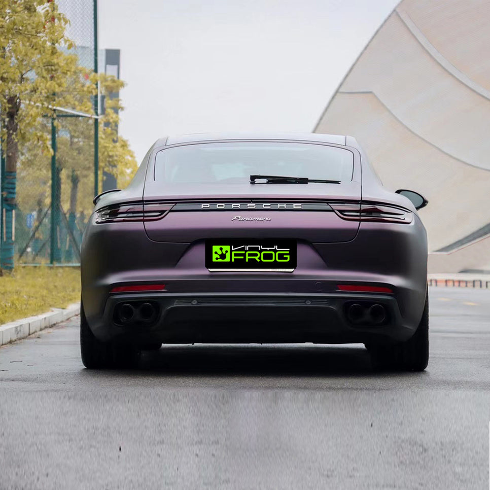 Porsche Panamera wrapped in Matte Metallic Black Purple vinyl wrap back view.