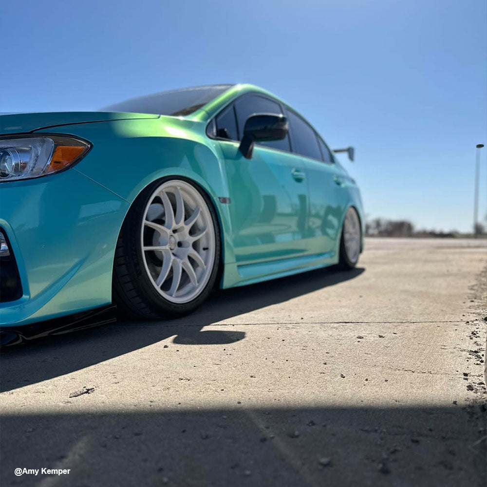Mercedes-Benz wrapped in Candy Metallic Neon Ice Blue vinyl wrap side view.