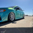 Mercedes-Benz wrapped in Candy Metallic Neon Ice Blue vinyl wrap side view.