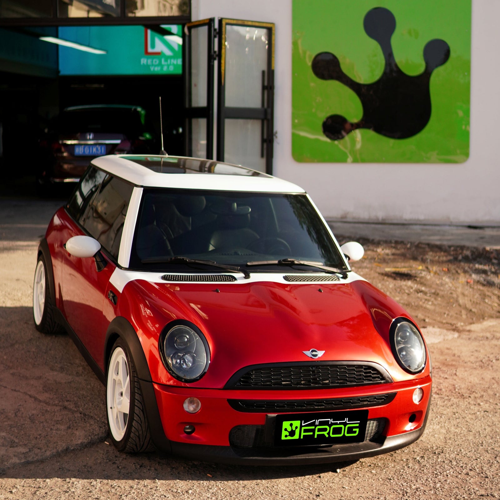 Mini Cooper wrapped in Glossy Metallic Dragon Blood vinyl wrap.