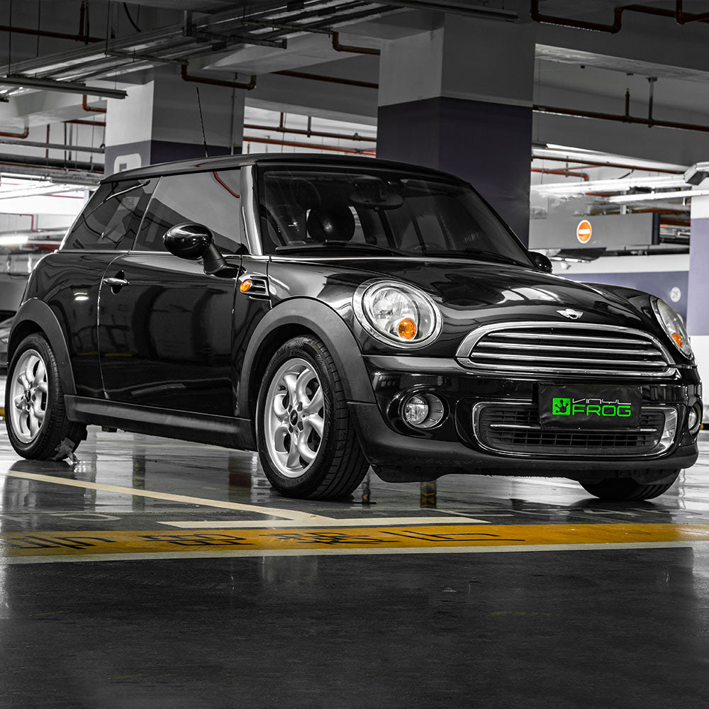 Mini Cooper wrapped in Glossy Metallic Metal Black vinyl wrap.