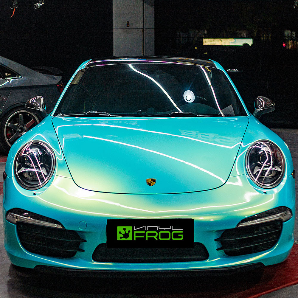 Porsche wrapped in Candy Metallic Neon Ice Blue vinyl wrap.