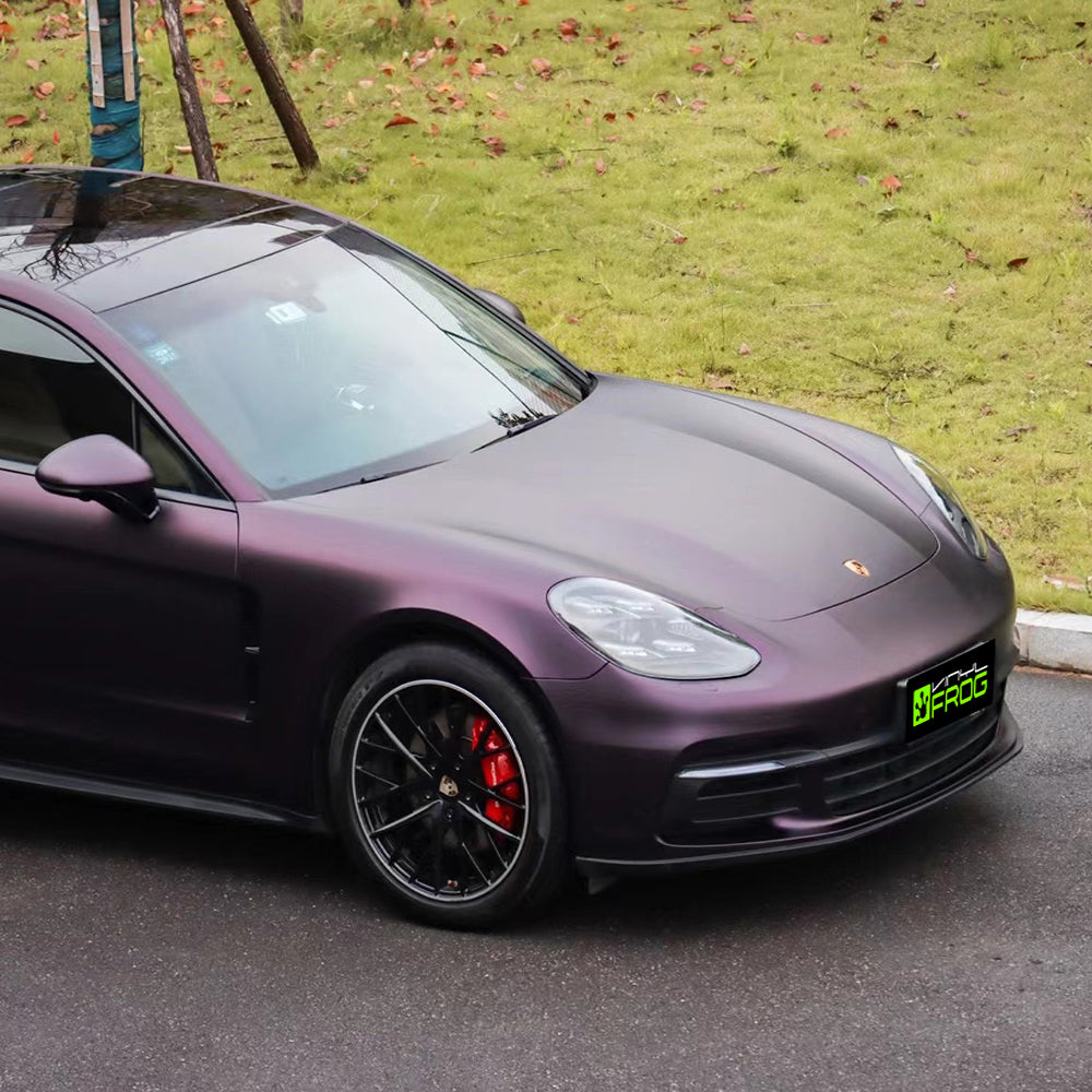Porsche Panamera wrapped in Matte Metallic Black Purple vinyl wrap.