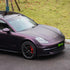 Porsche Panamera wrapped in Matte Metallic Black Purple vinyl wrap.