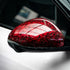 Glossy Red Forged Carbon Fiber Vinyl Wrap applied on car side mirror.