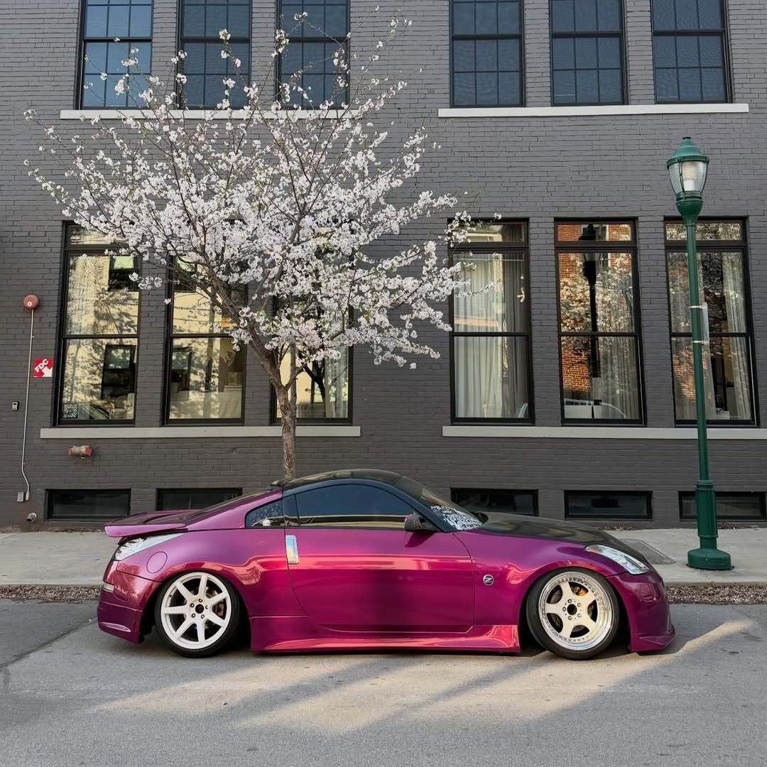 Glossy Metallic Rich Maroon Vinyl Wrap on Road