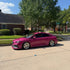 Side view of sedan wrapped in High Glossy Ruby Star Vinyl Wrap
