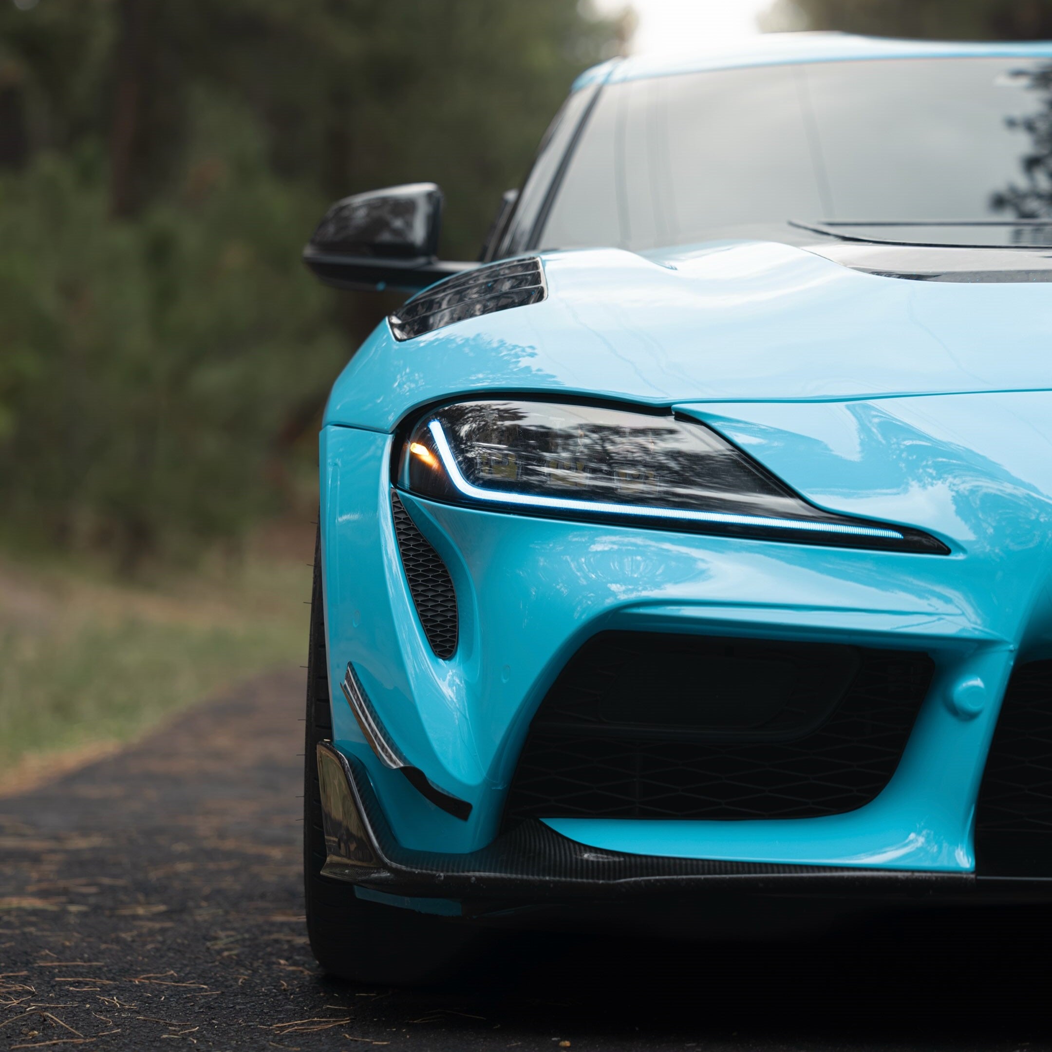 Front view of Supra wrapped in High Glossy Sky Blue Vinyl Wrap
