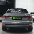 Audi A5 wrapped in Super Glossy Nardo Gray vinyl wrap back view.