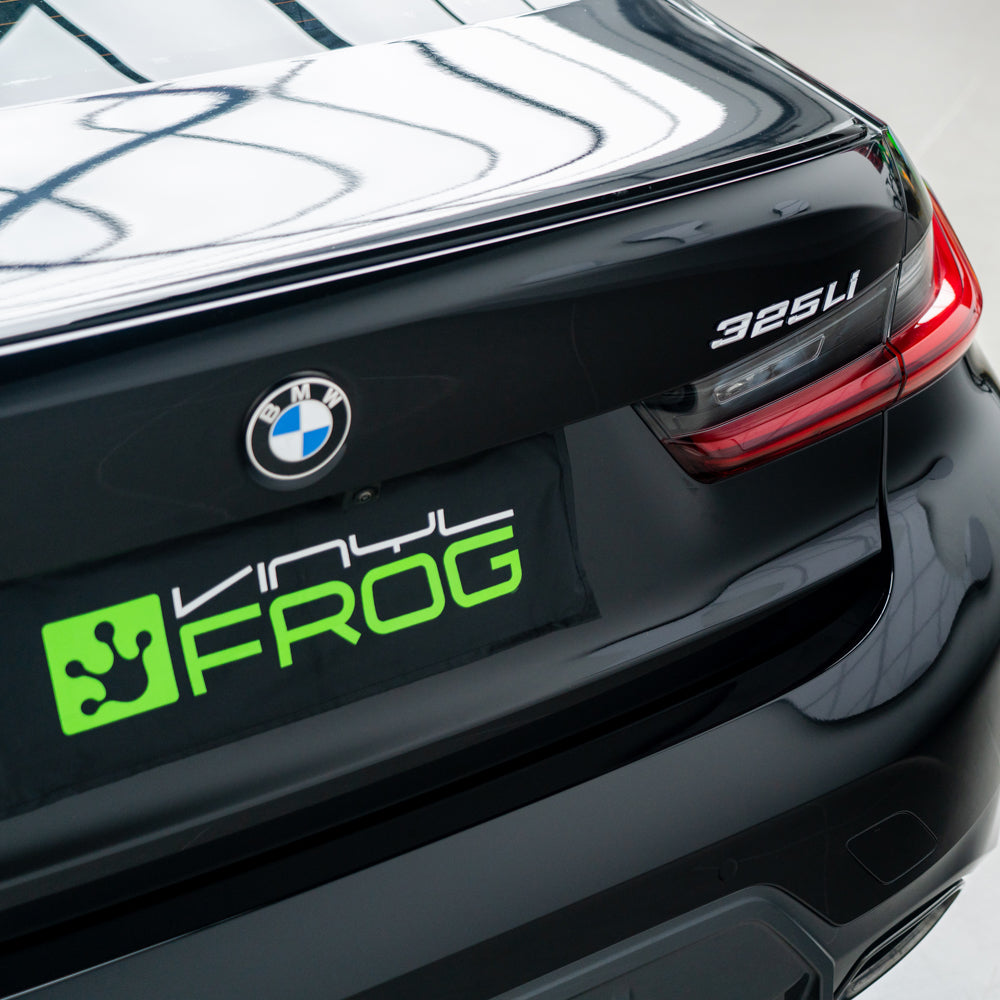 BMW 3 Series 325Li wrapped in Super Glossy Piano Black vinyl wrap back view 