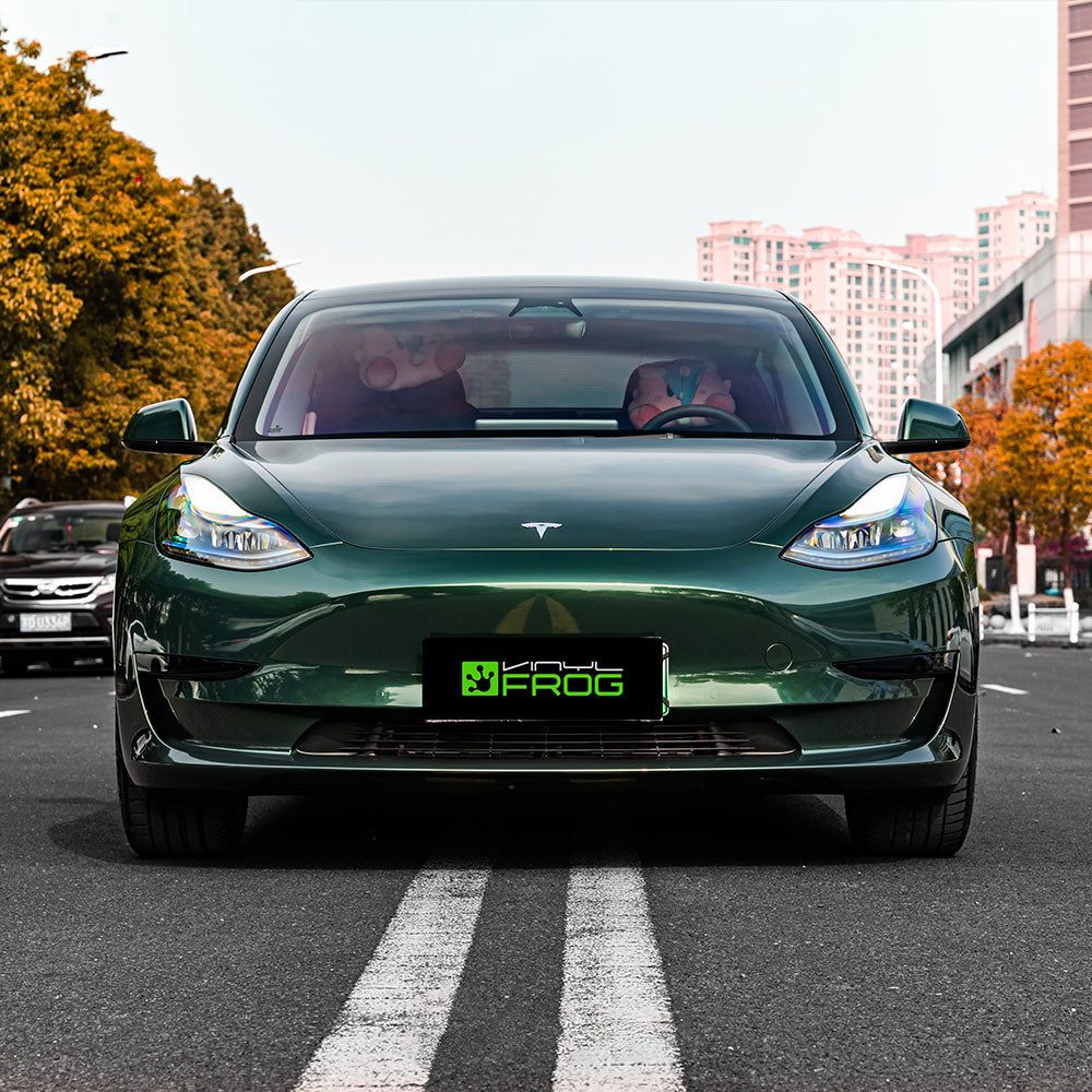 Tesla Model 3 wrapped in Glossy Metallic Gotland Green vinyl wrap.