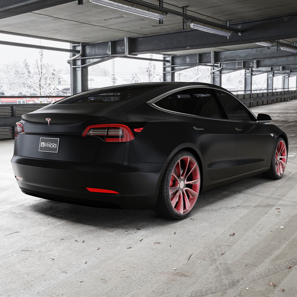 Tesla Model 3 wrapped in Matte Silk Black Vinyl Wrap on road.