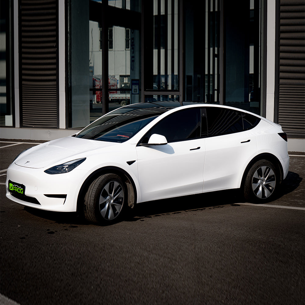Tesla Model Y wrapped in High Glossy Crystal White vinyl wrap.