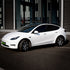 Tesla Model Y wrapped in High Glossy Crystal White vinyl wrap.
