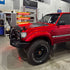 Toyota Land Cruiser 80 Series Front Detail in Glossy Metallic Vampire Red Color PPF