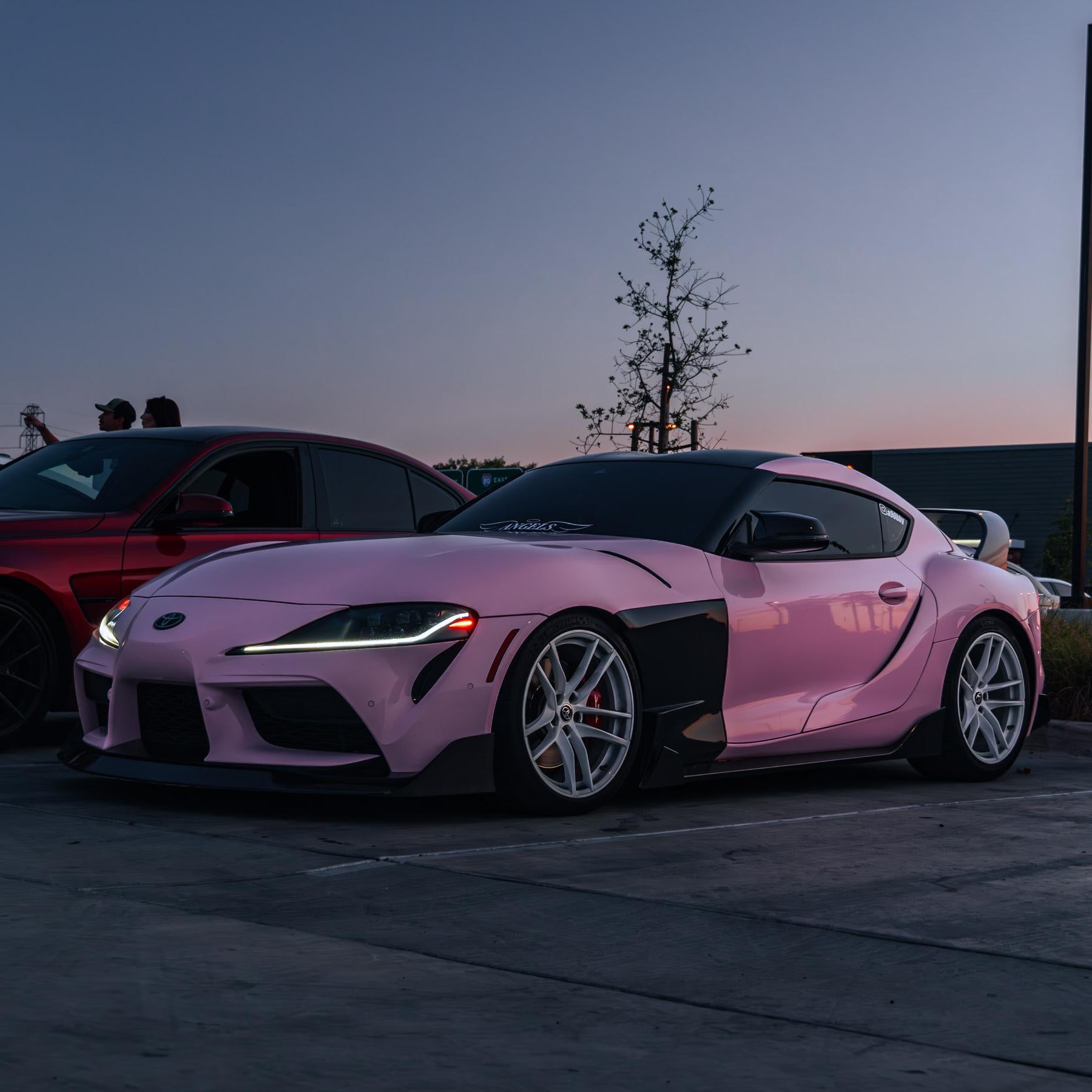 Toyota Supra wrapped in High Glossy Baby Pink vinyl wrap.