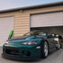 Glossy Metallic Deep Sea Green Vinyl Wrap on  Mitsubishi