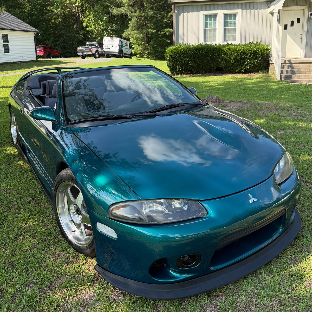 Front view of Mitsubishi Glossy Metallic Deep Sea Green Vinyl Wrap