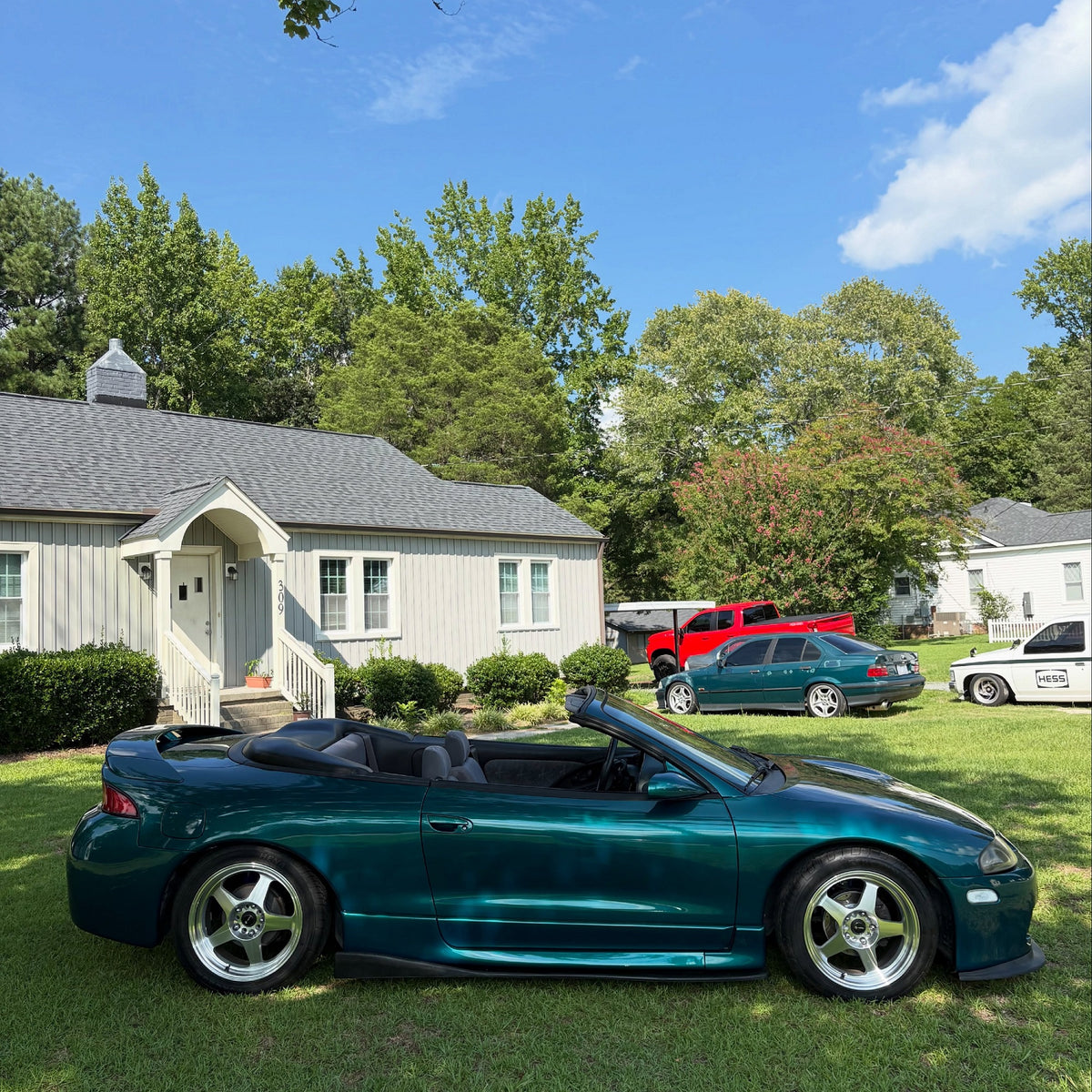 Side view of Mitsubishi Glossy Metallic Spanish Viridian Vinyl Wrap