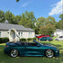 Side view of Mitsubishi Glossy Metallic Spanish Viridian Vinyl Wrap