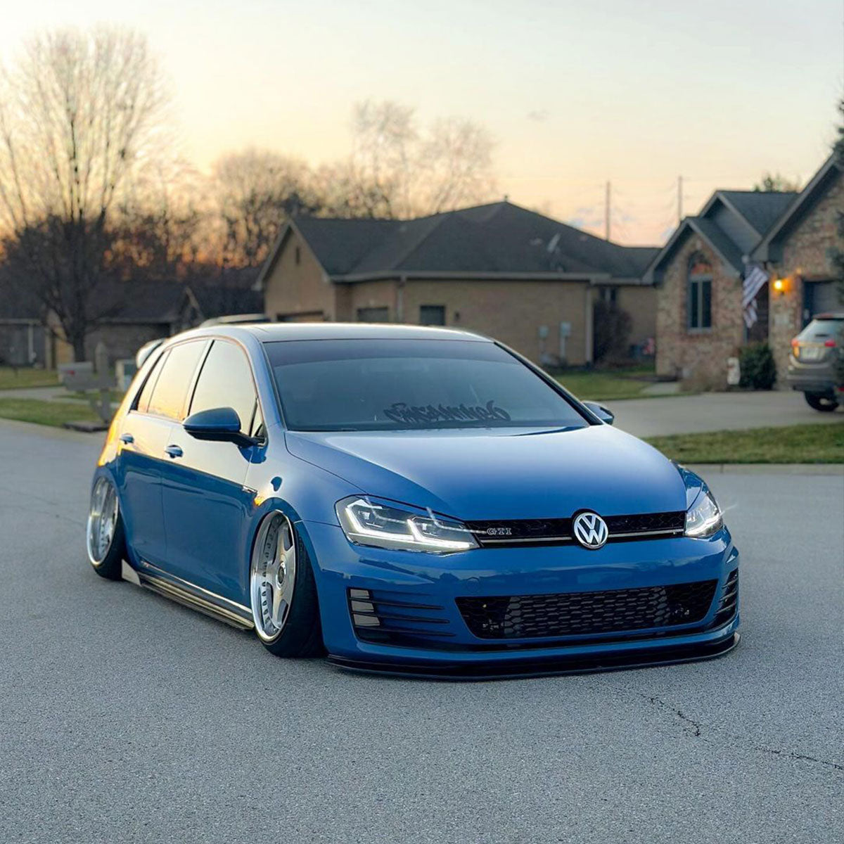 Volkswagen Golf GTI wrapped in High Glossy Laguna Blue vinyl wrap.