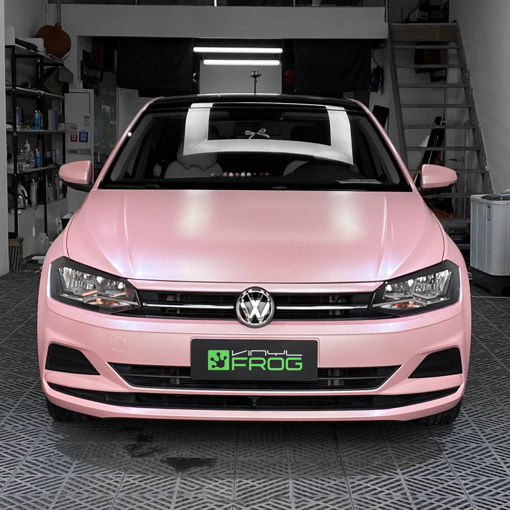 Volkswagen Golf wrapped in Matte Metallic Pearl Baby Pink vinyl wrap.