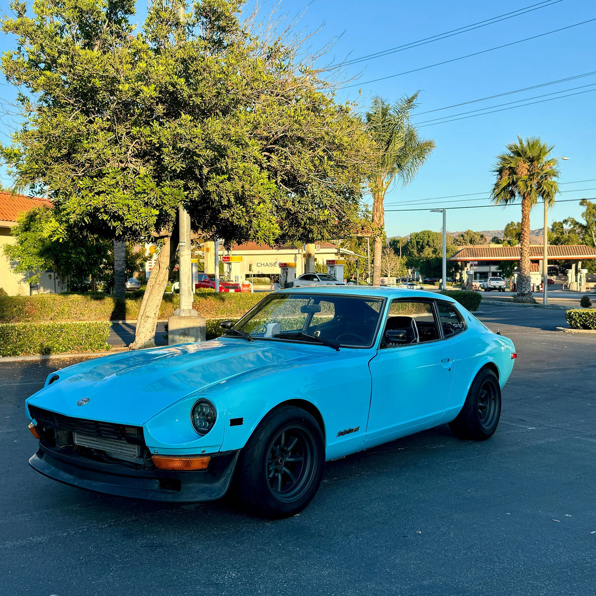 Classic sports car in High Glossy Sky Blue Vinyl Wrap