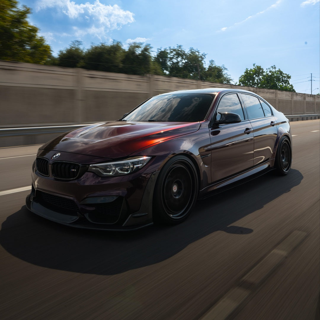 BMW wrapped in Glossy Metallic Plum Purple vinyl wrap on road