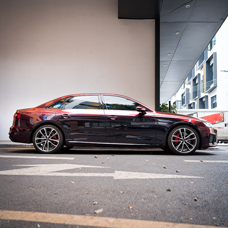 Audi wrapped in Rainbow Drift Black Red vinyl wrap.