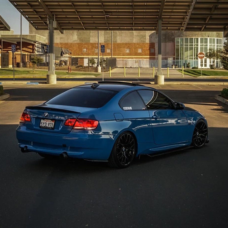 BMW M3 wrapped in High Glossy Laguna Blue vinyl wrap back view.